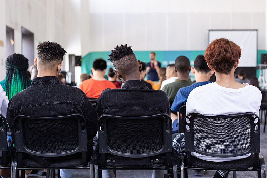 Students watching a lecture (photo taken from back of classroom)